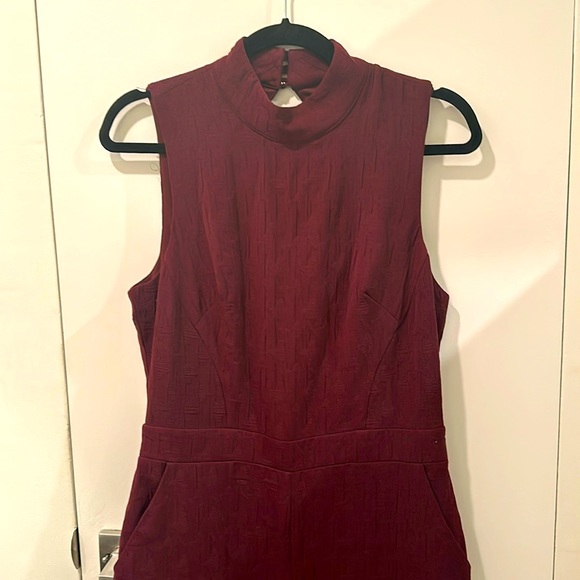 Brand new plum jumpsuit. Cute cutout in the back. Small. With tag. Sleeveless - Picture 2 of 5